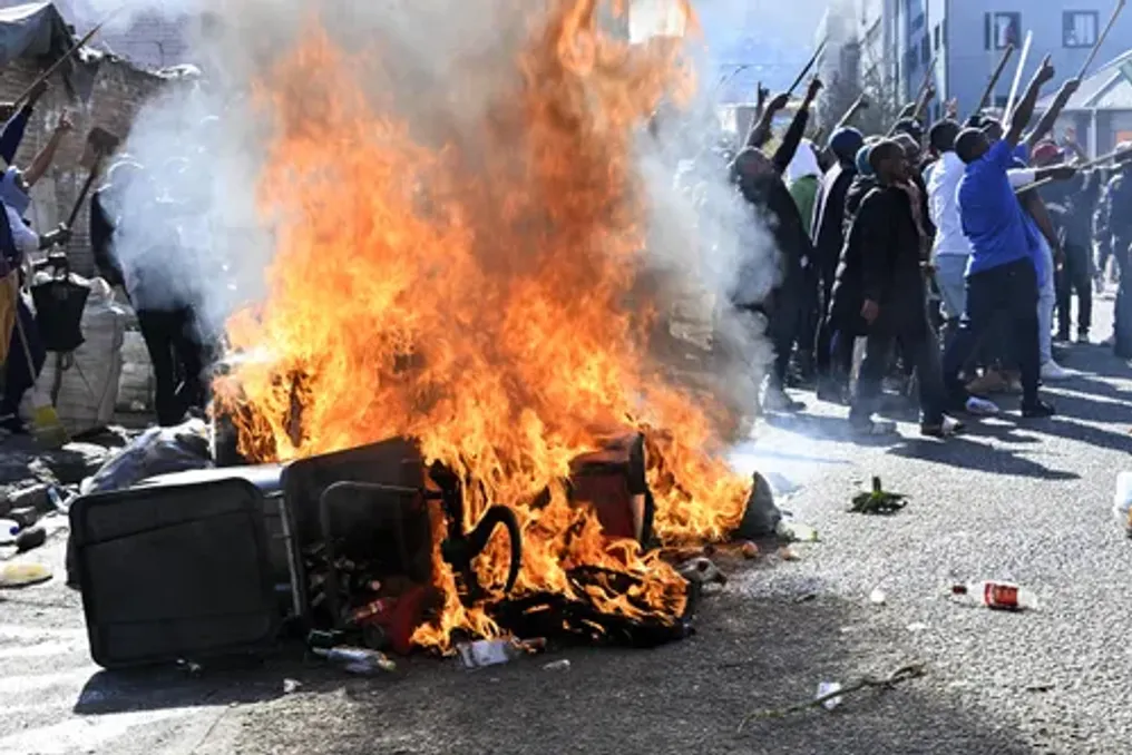 Local residents protest in Johannesburg demanding action against illegal immigration