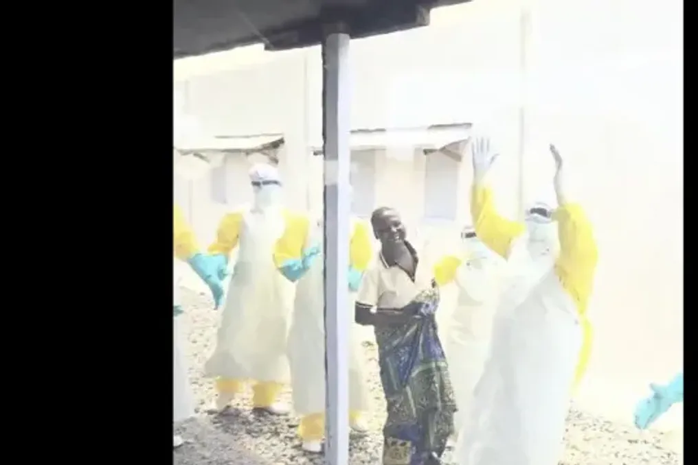 Doctors celebrate Ebola patient discharge in Mongbwalu, Democratic Republic of Congo